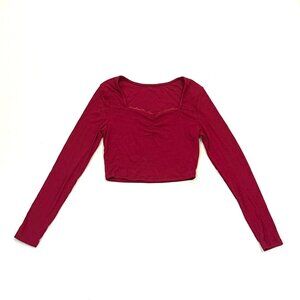 cropped red long sleeve top w/ lace detailing and square neck